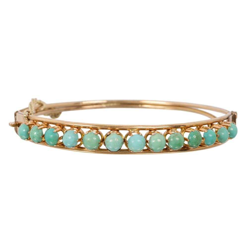 An antique turquoise and 14k gold bangle bracelet