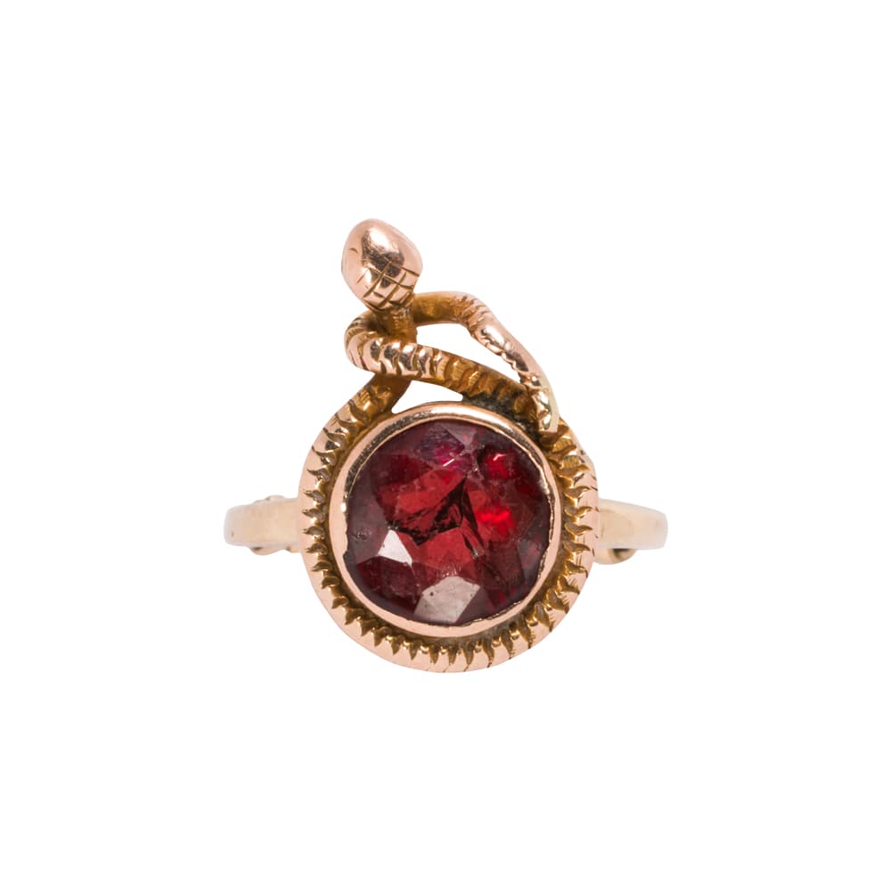 A Victorian garnet and 14k gold snake ring