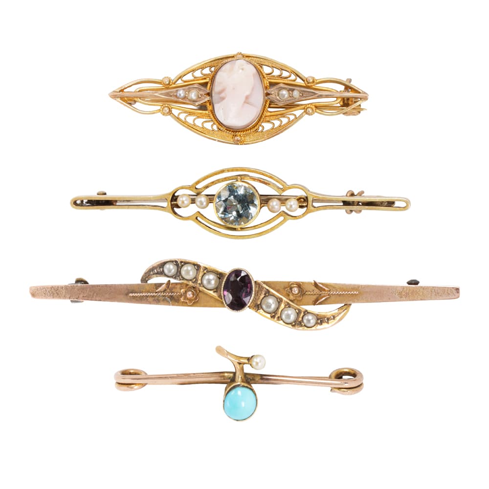 Four antique gold and gem-set pins