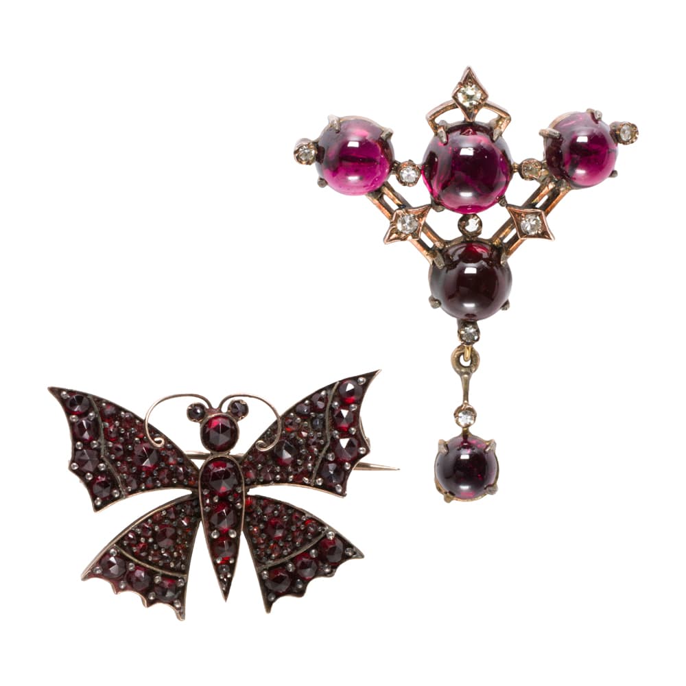 Two antique garnet, diamond and gilt metal brooches