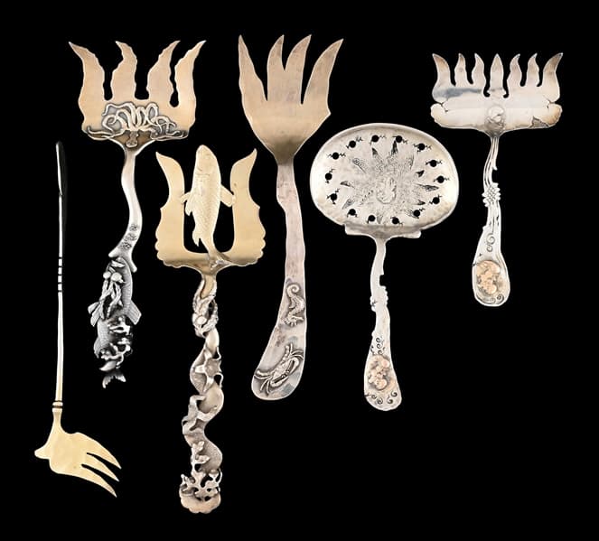 A GROUP OF SHIEBLER STERLING SARDINE FORKS AND A SCOOP