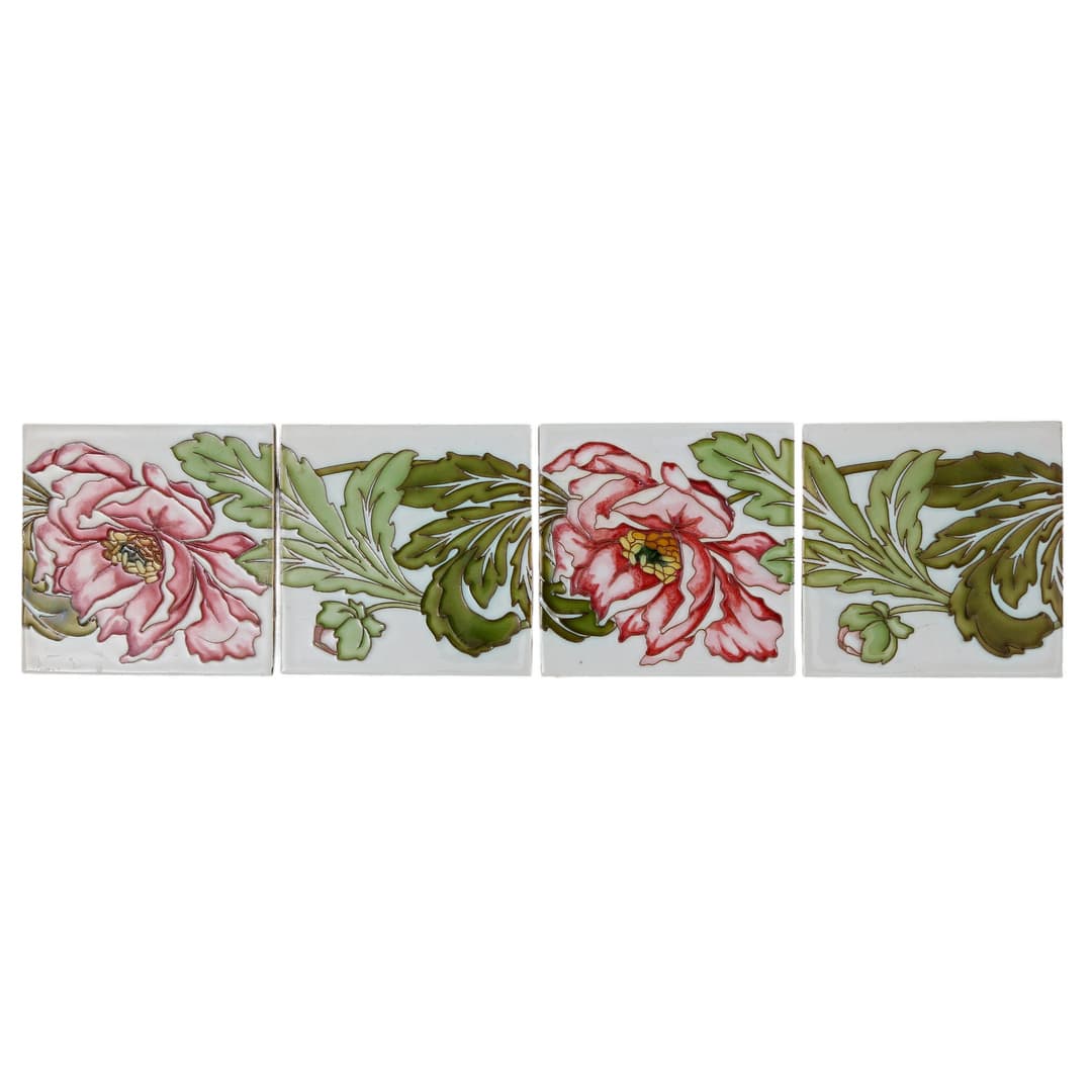 Set of four cuerda tiles with peonies, likely Belgian by Maison Helman
