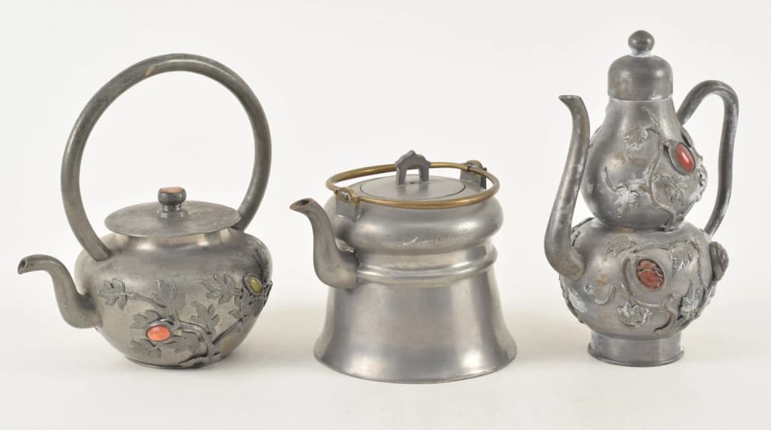 Lot of 3 antique Chinese pewter teapots. 1) Wide brass handled teapot.