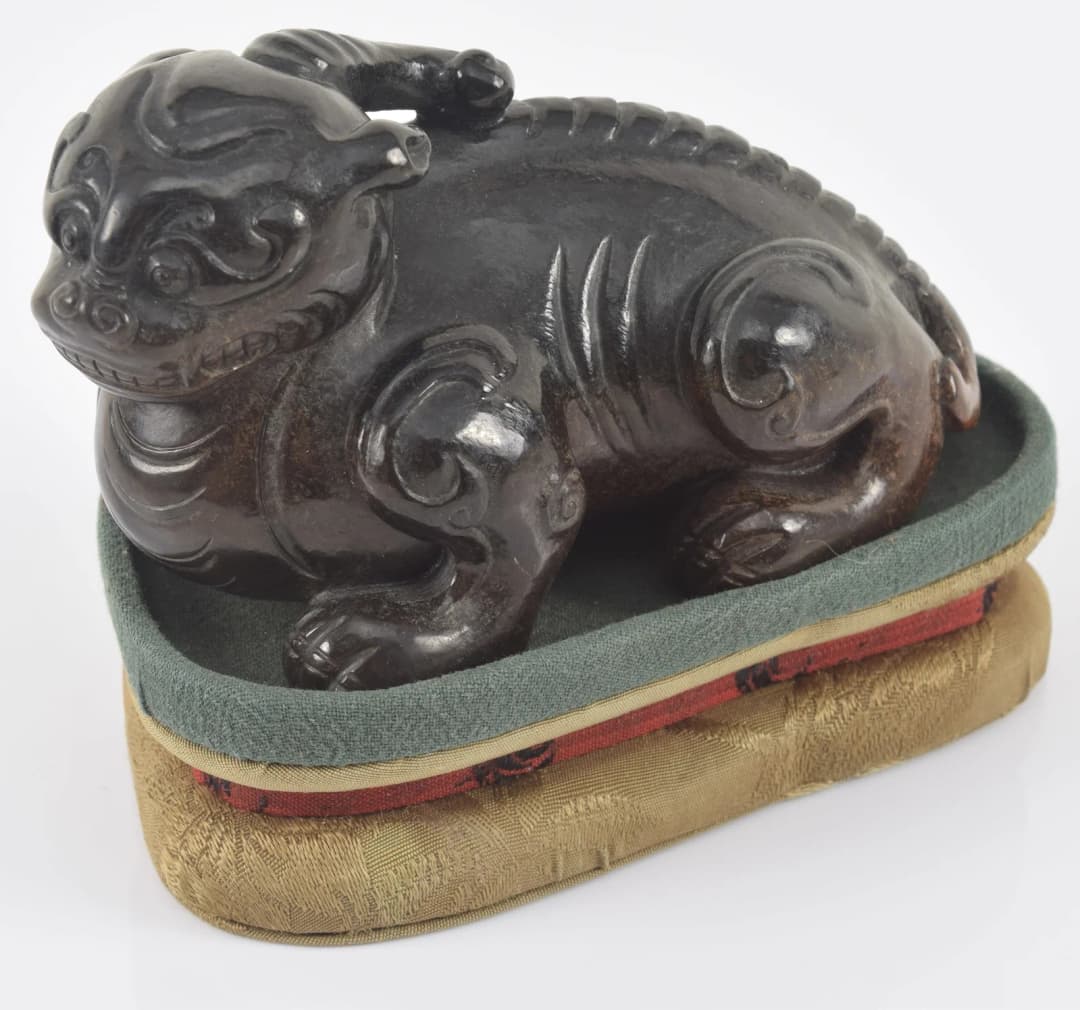 Jade luodan. China. Ming period (1368-1644). Fitted cloth stand. 4.25