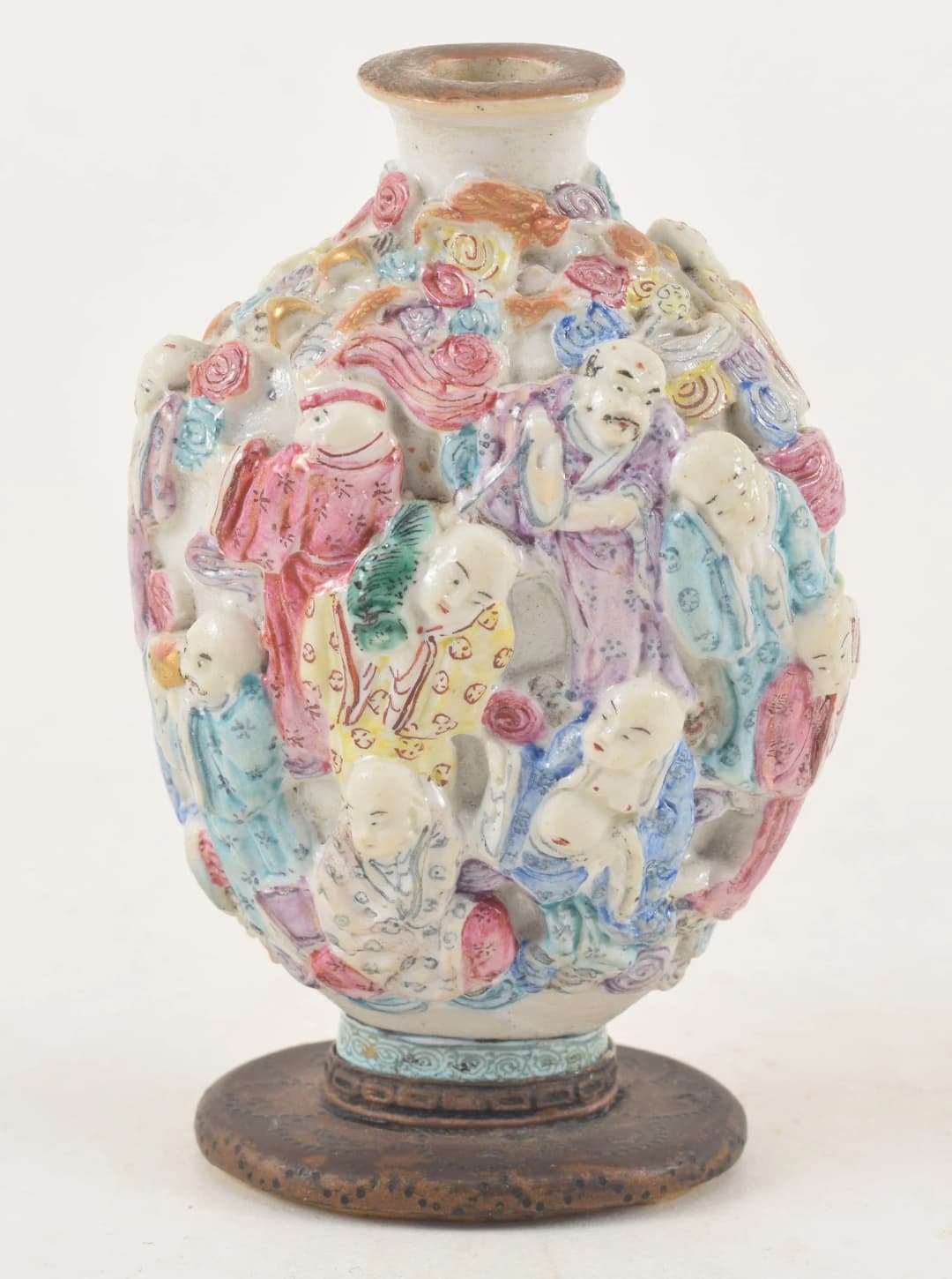 19th century Chinese porcelain snuff bottle. Polychrome carved and