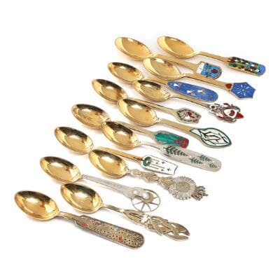 A selection of 13 gilded sterling silver Christmas spoons and a commemorative