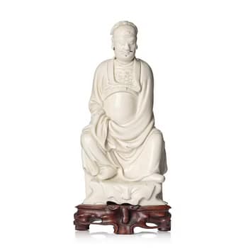 A blanc de chine figure of Guandi, Qing dynasty, 18th century.