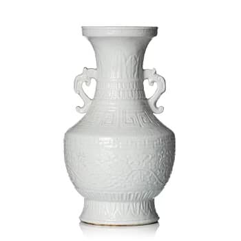 A blanc de chine 'lotus' vase, Qing dynasty 18/19th century.