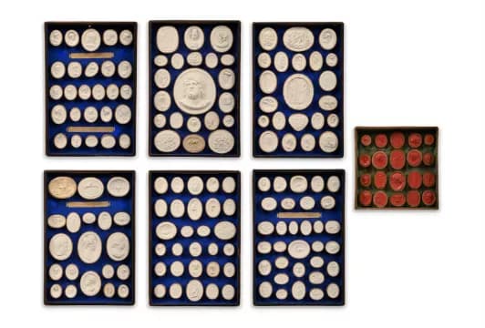 A SET OF FIVE TRAYS OF GRAND TOUR PLASTER INTAGLIOS, EARLY 19TH CENTURY