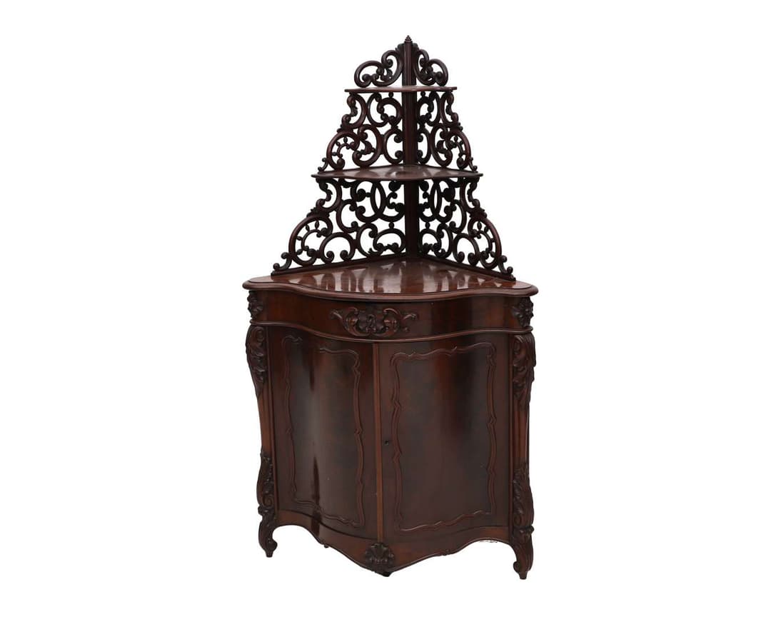 A mahogany corner cupboard with etagiere stand, Europe, 19th century
