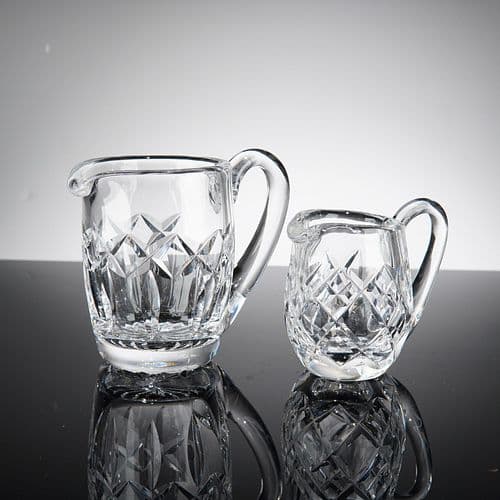 A Pair of Cut Lead Crystal Graduated Creamers, Attributed to Waterford