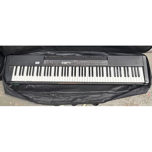 A Yamaha P80 electric piano and stand in a soft case