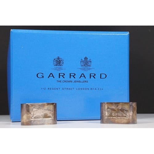 A pair of fully hallmarked sterling silver horse racing them...