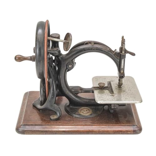 An American hand crank sewing machine. Early 20th century, b...